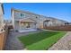 The private backyard features a small patio and a grassy area, perfect for outdoor relaxation and entertaining at 1011 White Leaf Cir, Castle Rock, CO 80108
