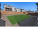 A well-maintained backyard featuring a spacious lawn area, gravel accents and wooden fencing provides privacy at 1011 White Leaf Cir, Castle Rock, CO 80108