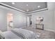 Bedroom shows a trey ceiling, plush carpet, neutral walls, and en suite bathroom access at 1011 White Leaf Cir, Castle Rock, CO 80108