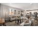 Comfortable living room with an open floor plan, hardwood floors, and sliding door access at 1011 White Leaf Cir, Castle Rock, CO 80108
