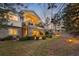 This multi-story house has a stone facade and well-manicured yard and garden at 1 Canon Pl, Greenwood Village, CO 80111