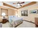 Bright bedroom featuring a ceiling fan, ample natural light, and neutral decor at 1 Canon Pl, Greenwood Village, CO 80111