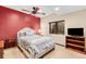 This bedroom features a ceiling fan, a TV, and a window, with a comfortable bed at 1 Canon Pl, Greenwood Village, CO 80111