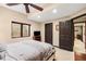 The bedroom has a cozy feel, with a small window and a TV on a shelf at 1 Canon Pl, Greenwood Village, CO 80111