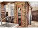 Dining area featuring a wine cooler, stone accents and access to the kitchen at 1 Canon Pl, Greenwood Village, CO 80111