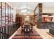 Vaulted dining room with stone accents and long table, perfect for gatherings at 1 Canon Pl, Greenwood Village, CO 80111