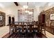 Elegant dining room with a large table, modern lighting, and stylish decor at 1 Canon Pl, Greenwood Village, CO 80111