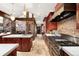 Large kitchen with stone accents, cherry cabinets and stainless steel appliances at 1 Canon Pl, Greenwood Village, CO 80111