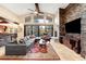 Bright living room boasting a stone accent wall, vaulted ceiling, and floor-to-ceiling windows at 1 Canon Pl, Greenwood Village, CO 80111