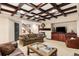 Comfortable living room includes a fireplace, a built-in tv console, and staircase access at 1 Canon Pl, Greenwood Village, CO 80111