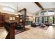 Spacious living space with a stone accent wall open to a dining area, perfect for entertaining at 1 Canon Pl, Greenwood Village, CO 80111