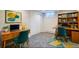 Finished basement office space featuring desks and bookshelves, perfect for a productive work environment at 1701 S Newport Way, Denver, CO 80224