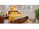 Bright bedroom with a cozy bed, complemented by stylish furniture and natural light at 1701 S Newport Way, Denver, CO 80224