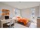 Well-lit bedroom with a desk, offering a comfortable and functional living space at 1701 S Newport Way, Denver, CO 80224