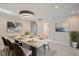 Elegant dining room with contemporary lighting and stylish decor for sophisticated dining at 1701 S Newport Way, Denver, CO 80224