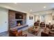 Inviting living room boasts a brick fireplace, comfortable seating, and a stylish coffee table at 1701 S Newport Way, Denver, CO 80224