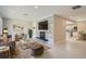 Modern living room features a decorative stone wall with a mounted TV and fireplace at 1701 S Newport Way, Denver, CO 80224