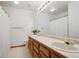 Bathroom with double vanity, lots of counter space, and neutral finishes at 7354 S Robb St, Littleton, CO 80127