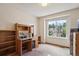 Study room features a large window, desk and bookshelf at 7354 S Robb St, Littleton, CO 80127