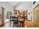 Open concept dining room adjacent to the kitchen and featuring sliding door to the exterior at 7354 S Robb St, Littleton, CO 80127