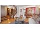 Open foyer with hardwood floors leading to the staircase and living areas at 7354 S Robb St, Littleton, CO 80127