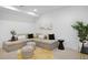 Cozy basement featuring neutral tones, modern furniture, and stylish accents at 2857 S Pancratia St, Denver, CO 80236