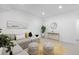 Finished basement with stylish furniture, neutral colors, and a view of the door at 2857 S Pancratia St, Denver, CO 80236