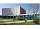 Bright commercial building featuring an intricate design with blue-tinted glass and well-maintained landscaping at 2857 S Pancratia St, Denver, CO 80236