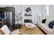 Bright living room with fireplace, comfortable seating, and view to the kitchen and dining area at 2857 S Pancratia St, Denver, CO 80236