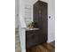 Pantry area featuring modern cabinets and shelving next to staircase at 2857 S Pancratia St, Denver, CO 80236