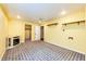 Finished basement with yellow walls, recessed lighting, decorative fireplace, and closet for additional storage or living space at 1824 Asoka St, Strasburg, CO 80136