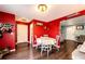 Cozy dining area with wood flooring, perfect for Gathering meals and gatherings at 1824 Asoka St, Strasburg, CO 80136