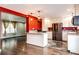 Open kitchen with granite countertops and stainless steel appliances at 1824 Asoka St, Strasburg, CO 80136