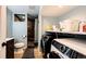Convenient laundry room with modern washer and dryer next to toilet and shower at 1824 Asoka St, Strasburg, CO 80136