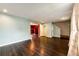 Inviting living space with hardwood floors and a seamless transition to other living areas at 1824 Asoka St, Strasburg, CO 80136
