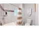 Updated bathroom featuring subway tile, unique accent tile, and built-in storage at 1137 Colorado Blvd, Denver, CO 80206