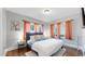 Cozy bedroom with hardwood floors, ample natural light, and stylish decor at 1137 Colorado Blvd, Denver, CO 80206
