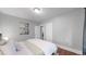 Calm bedroom space featuring a white bed and doorway to another room at 1137 Colorado Blvd, Denver, CO 80206