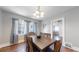 Elegant dining room featuring a wooden table with seating for six and natural light from the windows at 1137 Colorado Blvd, Denver, CO 80206