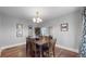 Charming dining area with a wooden table, seating for six, and wall decor adding character at 1137 Colorado Blvd, Denver, CO 80206