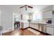 Clean kitchen featuring white cabinets, stainless steel appliances, and easy access to the adjacent dining area at 1137 Colorado Blvd, Denver, CO 80206