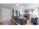 Cozy living room featuring a brick fireplace, built-in shelving, and a comfortable gray sofa for relaxation at 1137 Colorado Blvd, Denver, CO 80206
