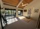 This bedroom features vaulted ceilings, a walk-out balcony and a yoga mat at 24226 Currant Dr, Golden, CO 80401