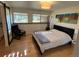 Bright bedroom with natural light, a modern light fixture, and contemporary artwork at 24226 Currant Dr, Golden, CO 80401