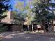 Spacious home with private drive, mature trees, lush green bushes and professional landscaping at 24226 Currant Dr, Golden, CO 80401