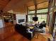Open concept living room with vaulted ceilings, wood floors, fireplace and bright natural light at 24226 Currant Dr, Golden, CO 80401
