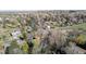 An aerial view captures the neighborhood with lush trees throughout at 2949 Vivian St, Wheat Ridge, CO 80215