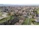 A stunning aerial view capturing the community with its pond and lush greenery, inviting residents to explore the outdoors at 2949 Vivian St, Wheat Ridge, CO 80215