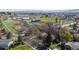 Overhead view showcases this home's peaceful neighborhood with mature trees, green lawns, and convenient street access at 2949 Vivian St, Wheat Ridge, CO 80215