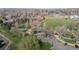 The aerial view showcases a neighborhood park, with pathways, and open green space for recreation and community enjoyment at 2949 Vivian St, Wheat Ridge, CO 80215